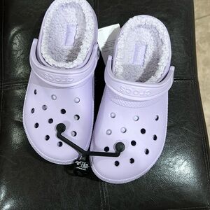 Women’s light purple crocs fleece lined women’s size 9 brand new with tags.